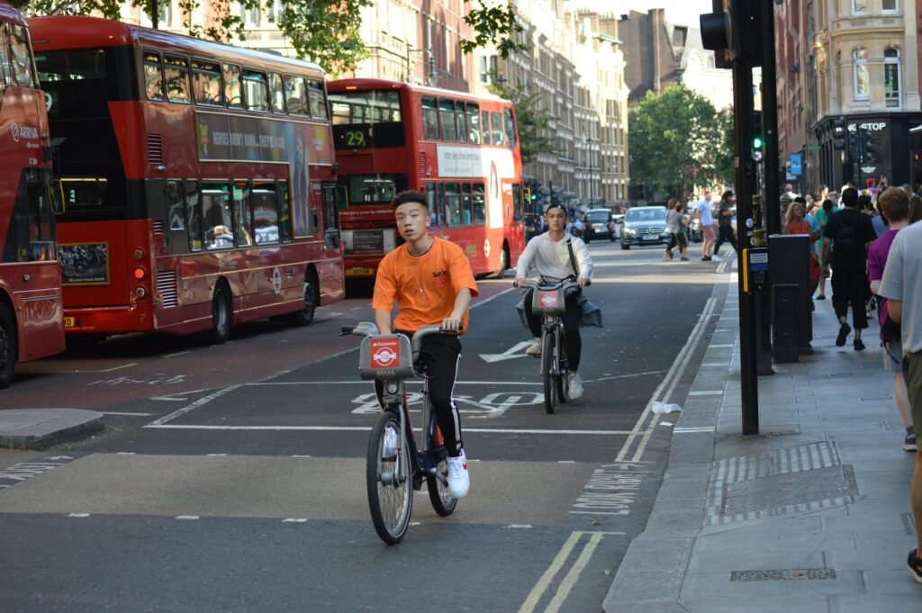 A protected bike lane running alongside a busy urban street