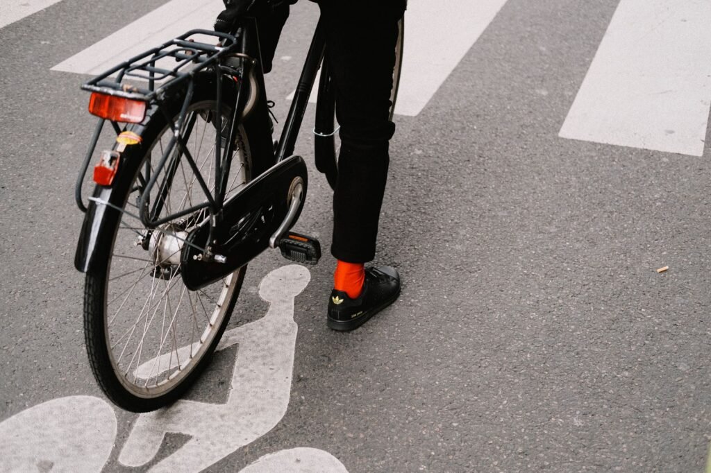 Dry commuting essentials laid out on a bench: bag liner, spare socks, a towel, and folded work clothes.
