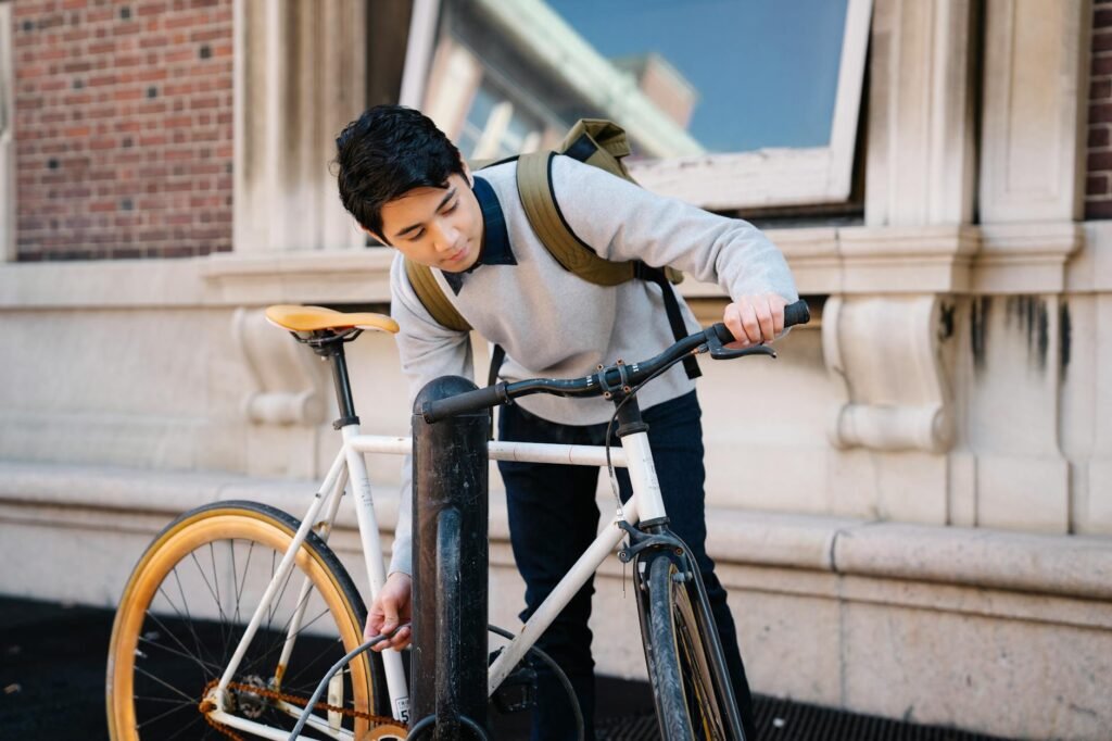 Basic cycling gear arranged neatly beside a commuter bike helmet and lights